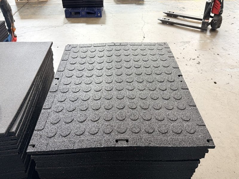 commercial gym owner inspecting new flooring